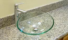 Granit bathroom countertop with glass vessel sink
