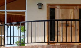 Iron terrace railing with entry door