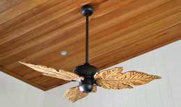 Tropical hardwood ceiling with recessed light and leaf blade ceiling fan
