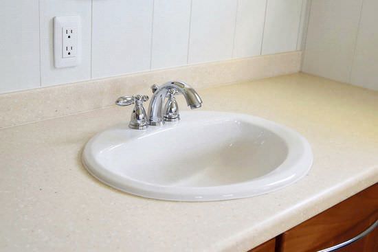 Corian bathroom countertop with white sink