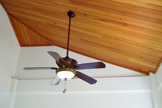 Cedar wood ceiling with bronze ceiling fan