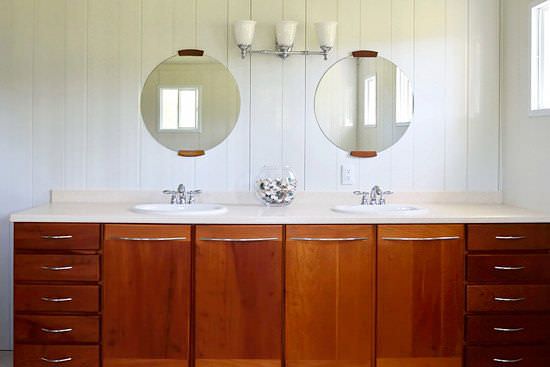Bathroom with double sinks and cedar wood cabinets