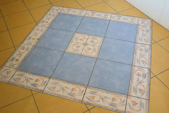 Mediterranean-style tile floor with flower design accent tiles
