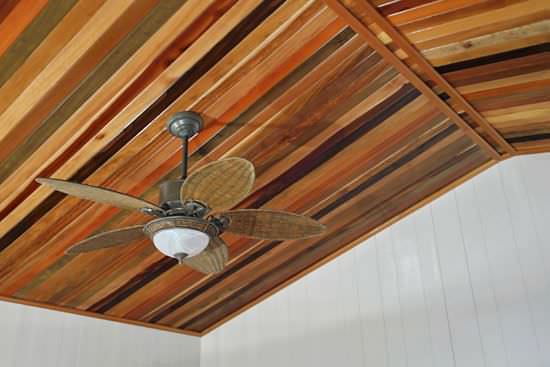 Mixed hardwood ceiling with tropical ceiling fan