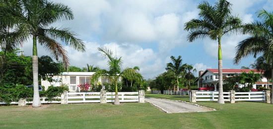Property with white wooden split rail fence